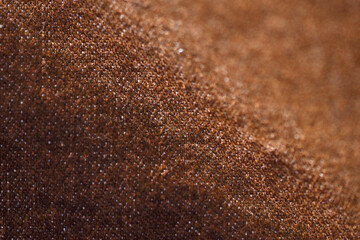Brown fabric textile texture close up , focus only one point , soft blured background