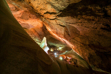 Massive ice formations and a tall iced pinnacle inside the Parzivaldom at the Dachstein Rieseneishöhle, a giant ice cave in the Austrian Alps