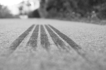 The brake track is a tire on the asphalt. Tire track. Shallow depth of field.
