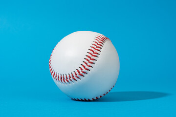 Minimalist stylish photo of baseball ball with harsh shadow. Close-up image of baseball ball on...