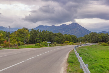 Balkan road trip. Cloudy autumn landscape with road in valley of Dinaric Alps. Bosnia and Herzegovina, Republika Srpska
