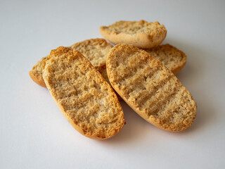 Cardamom rusks on white background