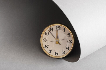 Fototapeta na wymiar Dial of a vintage hand watch on a gray background. The hands of