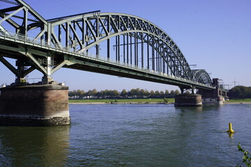 Fototapeta na wymiar The south bridge is a bridge over the Rhine in Cologne, Germany. The south bridge is the two-track rail, pedestrians and cyclists. Since its construction, it is mainly used by freight to complete.