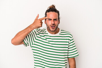 Young caucasian man isolated on white background showing a disappointment gesture with forefinger.