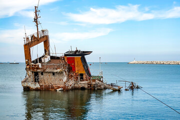 An old sunken ship in the harbor