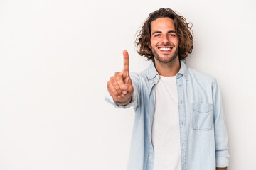 Young caucasian man isolated on white background showing number one with finger.