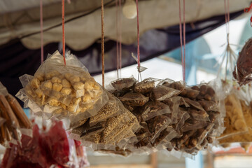 Various local ingredients prepacked and hanging at a local store in Malaysia.