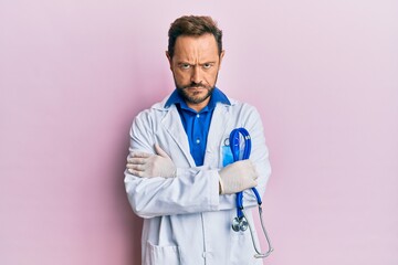 Middle age man wearing doctor uniform skeptic and nervous, frowning upset because of problem....