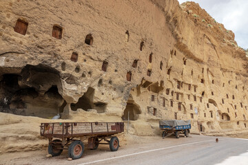 Chambers carved into the rocks and tractor trailer