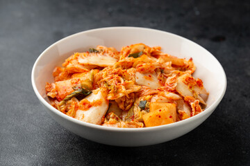Traditional Korean Kimchi Cabbage in white bowl. Healthy food.