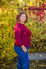 Plus size European or American mature woman at park, enjoy the life, walks. Life of people xl size, happy nice natural beauty woman. Concept of overweight