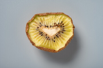 dried kiwi fruit slice on grey background