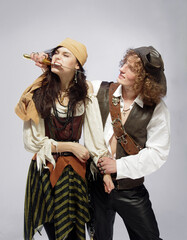 Fototapeta premium A guy and a girl in pirate costumes.