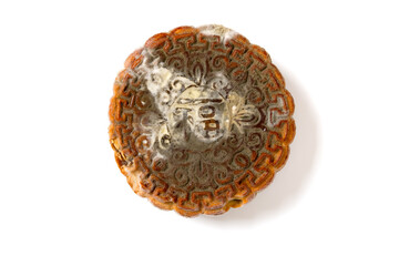English translation of the Chinese-fortune-top view badly moldy moon cake on white background