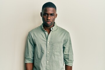 Young african american man wearing casual clothes depressed and worry for distress, crying angry and afraid. sad expression.