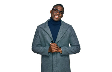 Young african american man wearing business clothes and glasses with hands together and crossed fingers smiling relaxed and cheerful. success and optimistic