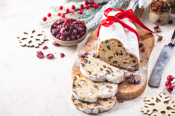 Christmas Stollen. Traditional Sweet Fruit Loaf with Icing Sugar. Xmas holiday table setting.