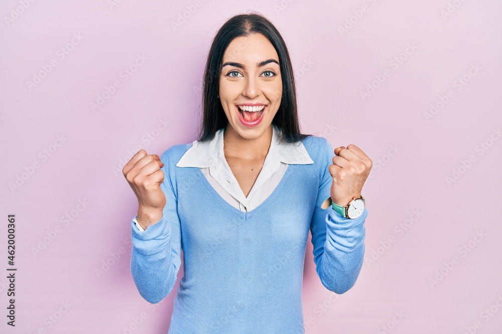 Poster beautiful woman with blue eyes standing over pink background celebrating surprised and amazed for su