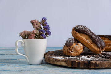 Traditional French dessert. Eclair with chocolate icing. Pastery concept