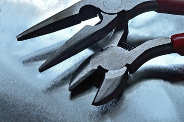 Pliers, wire cutters, round nose pliers. Locksmith tools