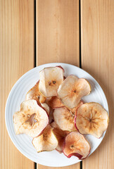 Apple Chips on Wooden Background With Copyspace