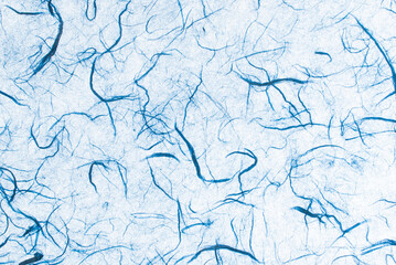 Light blue mulberry paper. Abstract background with small details of paper with natural fibers. Top view for copy spaces, designs, and advertisements