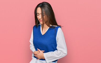 Fototapeta na wymiar Young hispanic girl wearing casual clothes with hand on stomach because indigestion, painful illness feeling unwell. ache concept.