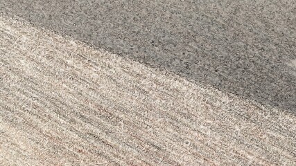 Abstraction in light colors. A straight line divides the plane diagonally, dividing it into two parts, the lower area in light browns and the upper area in dark browns. Abstract background.