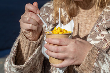 Hot boiled corn fresh, fast, tasty and healthy meal in paper glass.