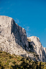 Fototapeta premium a beautiful rock against the blue sky. mountain landscape. space for text