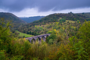 looking down over viaduct  bridge over the river Monsal head Derbyshire Monsal trial cycle and walking path