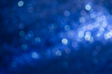 abstract blue bokeh glitter sparkle background.