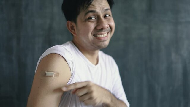 Asian Man Show Shoulder With Bandage After Injection A Vaccination Protection The Coronavirus