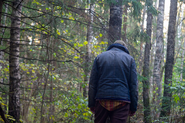 lonely man in deep forest