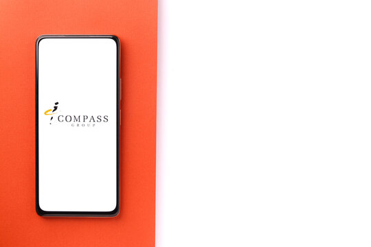 West Bangal, India - October 09, 2021 : Compass Group logo on phone screen stock image.