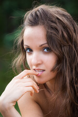 Portrait of an young woman on natural background