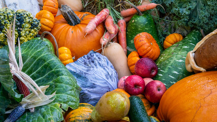 Pumpkins, vegetables, fruits, apples, chestnut on display on a local vegetable market. Harvest day.