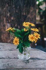 bouquet of yellow flowers in vase