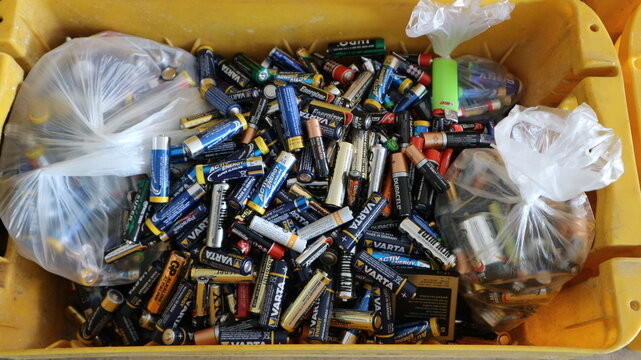 Container filled with batteries for recycling in a household recycling center 