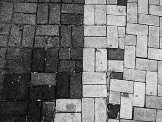 the black and white pavement arrangement for grunge background texture. aged texture for creative street design elements.
