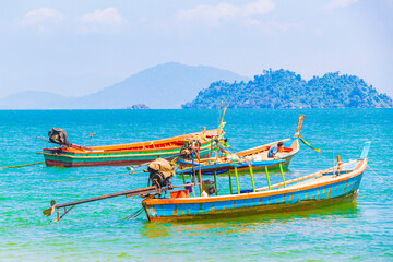 Long-tail boats at pier on island Koh Phayam Thailand.