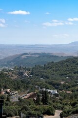 Fototapeta na wymiar Armenia, Tsaghkadzor, September 2021. Vertical view of the village among the mountains.
