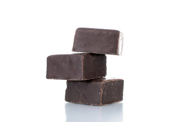 Three sweet chocolate candies, close-up, isolated on white.