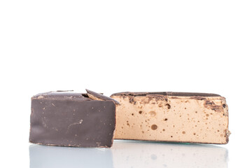 Two halves of sweet chocolate candy, close-up, isolated on white.