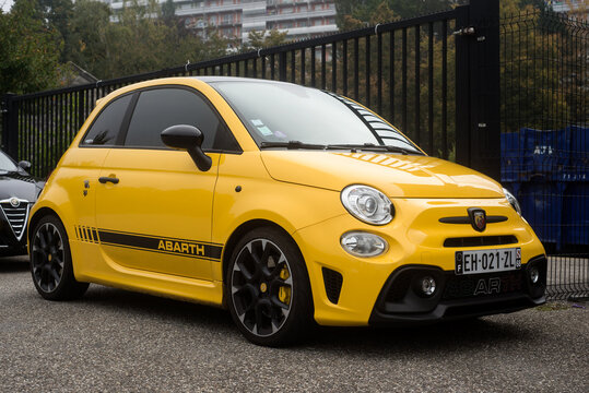 Mulhouse - France - 10 October 2021 - Front view of yellow Fiat 500 abarth 595 parked in the street