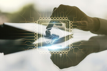 Double exposure of creative human brain microcircuit and hand working with a digital tablet on background. Future technology and AI concept