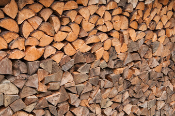 stacked chopped firewood. timber bars at a sawmill. wood background.