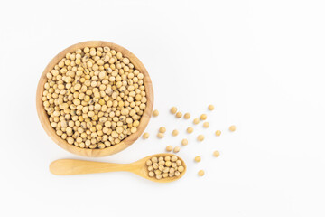 Soybean in wooden bowl and spoon on white background with free copy space 