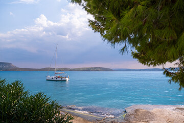 Catamaran sail Yacht cruising on deep blue sea water